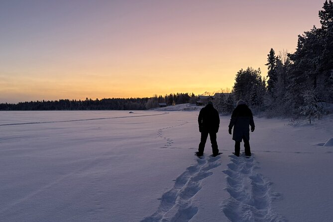 Arctic Reindeer Farm Experience with Snowshoeing in the Wild - Snowshoeing across a frozen lake and into the forest