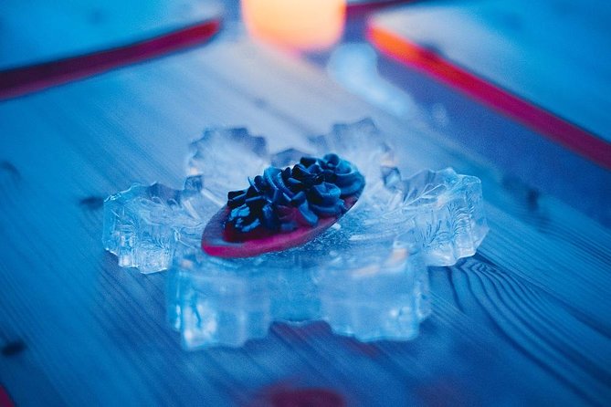 Arctic Snow Castle Visit with Lappish Dinner - Small Group Tour - The ice hotel rooms: 5 degrees, handmade carvings, and how to enjoy it safely