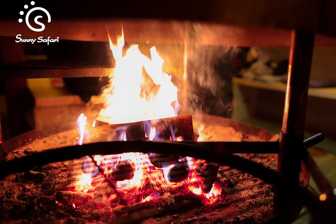 Aurora Borealis Trip in Lapland Lakeside - Campfire Comfort: Sausages, Berry Juice, and Warm Breaks