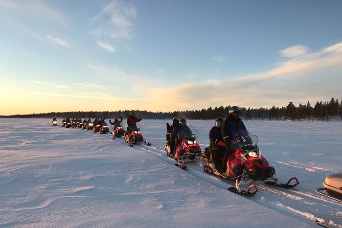 Easy Snowmobile Safari - First minutes on a thick frozen river, then into the forest