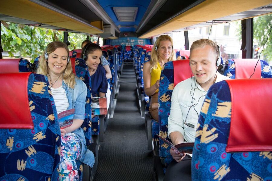 Helsinki: Bus Tour with Audio Guide - Mannerheimintie icons from the bus windows: Opera, Finlandia Hall, Parliament, and more