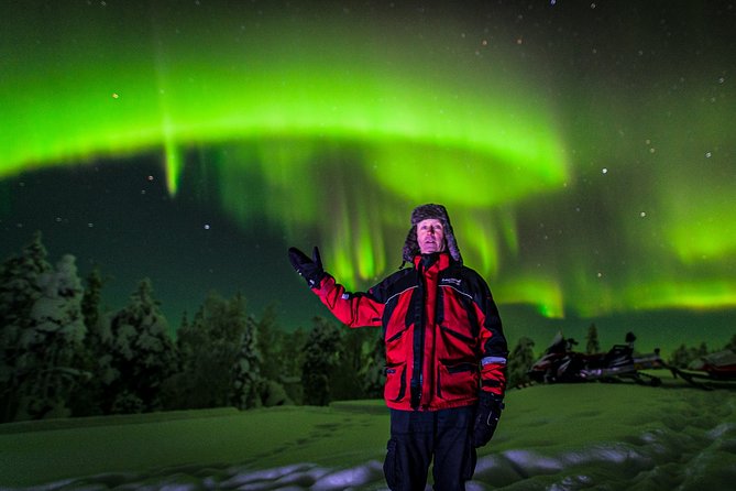 Hunting Northern Lights by Snowmobiles - The tepee and fire stop, where the warmth meets the skywatching