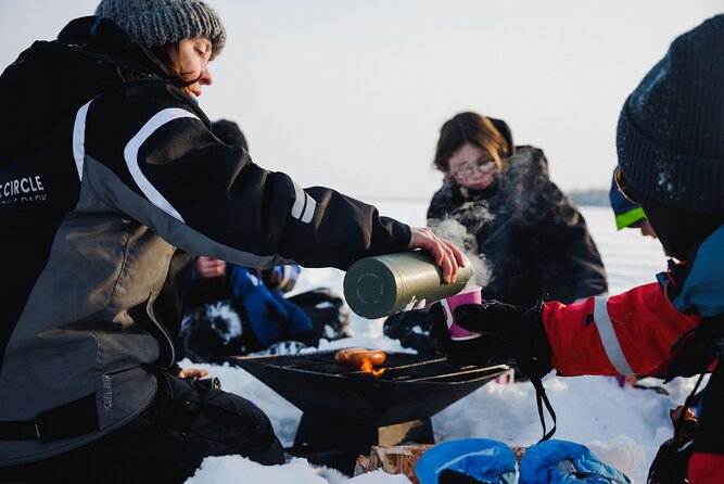 Ice Fishing and Snowmobile Safari Combo in Lapland - Ice fishing on a frozen lake, the parts you’ll remember