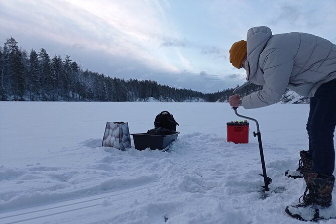 Ice fishing experience with Backpacker Helsinki Tour - Ice fishing in Helsinki, then warming up at the fire