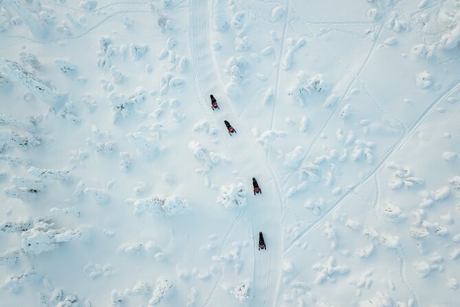 Lappish Lunch Break -Snowmobiling, ice fishing and tasty food - Why This Rovaniemi Snowmobile and Ice Fishing Combo Works So Well