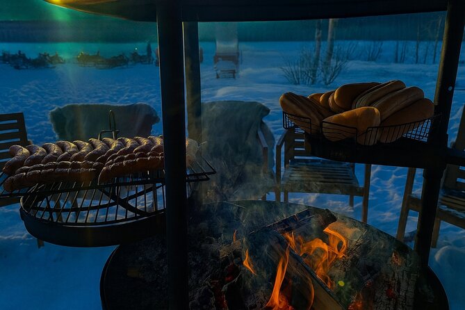 Rovaniemi: Drive New 2025 Snowmobiles - Aurora Adventure - What the barbecue and hot drinks by the fire are really for