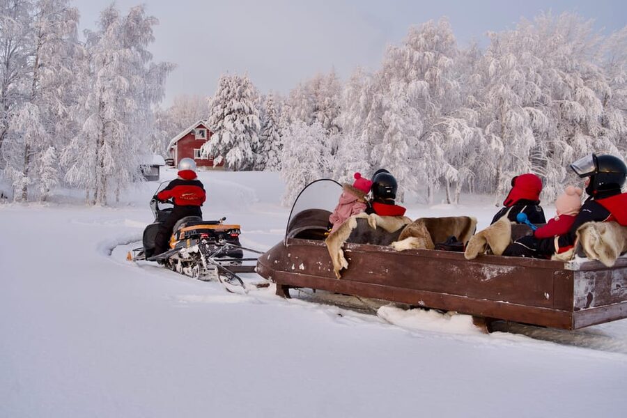 Rovaniemi: Ice Fishing and Snowmobile Tour with Snacks - Pickup to Warm Clothes: How the Tour Sets You Up