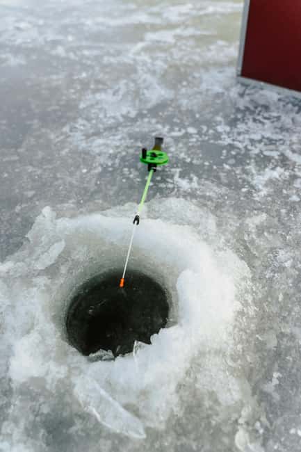 Rovaniemi: Ice Fishing Trip with Snacks and Drinks - Drilling the hole: you are not just watching, you are working