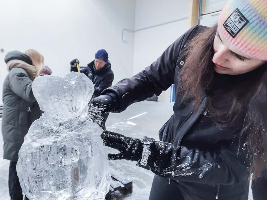 Rovaniemi: Ice sculpting experience with Transfers - First stop at the SnowHotel: Guided tour of ice rooms and structures