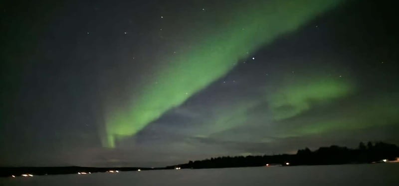 Rovaniemi: Northern Lights Hunters. Aurora + BBQ - Santa Claus Village photos at night, without the crowd crush