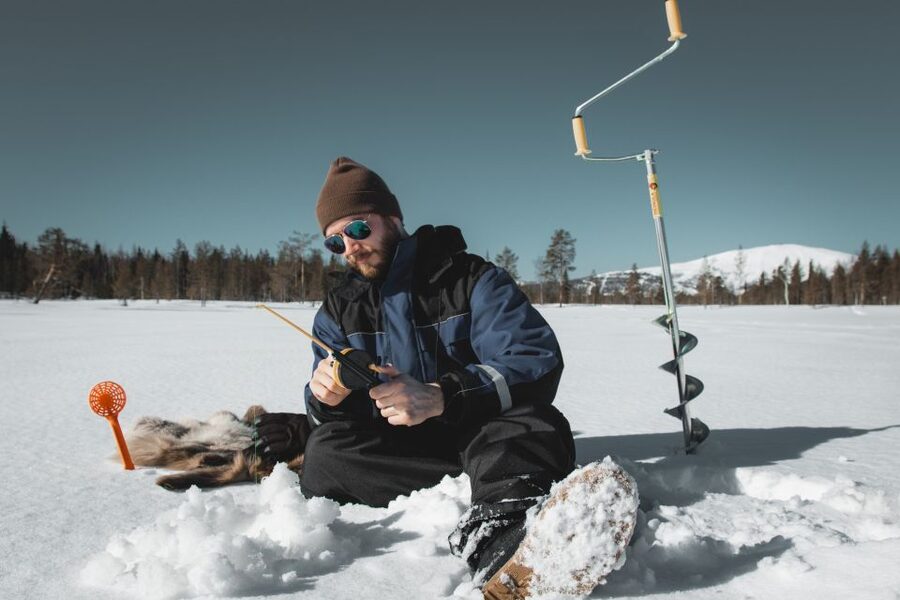 Saariselkä: Arctic Ice Fishing Experience - Sitting With the Line: The Waiting Game on Frozen Water