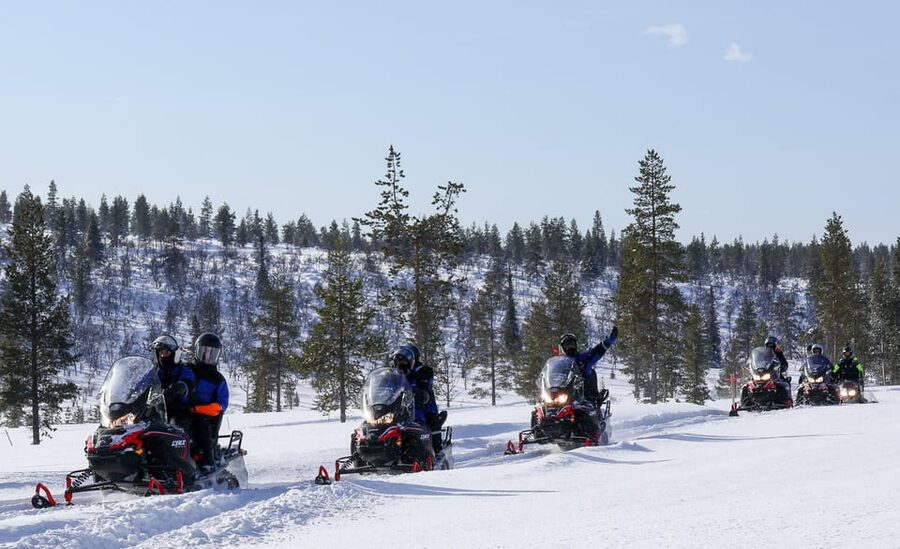Saariselkä: Ice Fishing Safari by Snowmobile - Reaching the frozen lake and drilling your first hole
