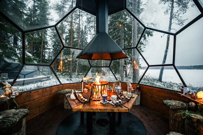 Santa Village Tour+Lapland Cuisine In Glass Igloo+Snow Scooters - Forest lunch, fireplace warmth, and Lapland cuisine in a glass igloo setup