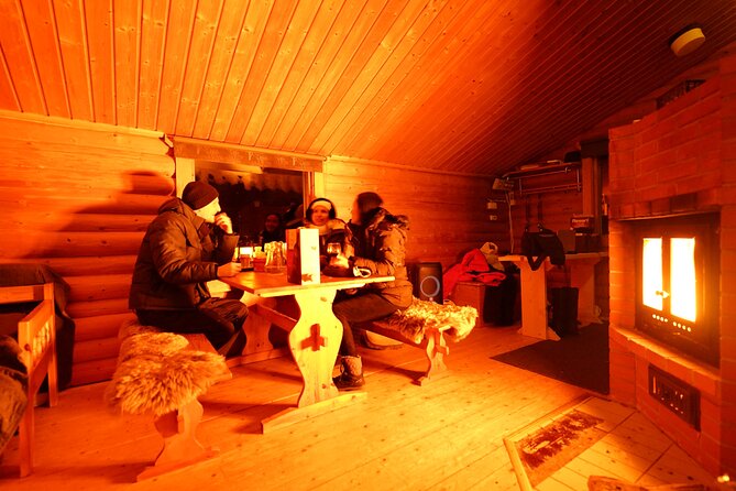 Snowmobile drive experience - Warming up in the cabin: sausages, hot drinks, and the salmon bonus