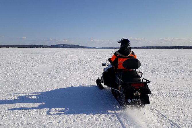 Snowmobile Safari to Lake Inari, meet & feed Reindeers, Lunch - Getting suited up in Ivalo: thermals, quick rules, and safety briefing