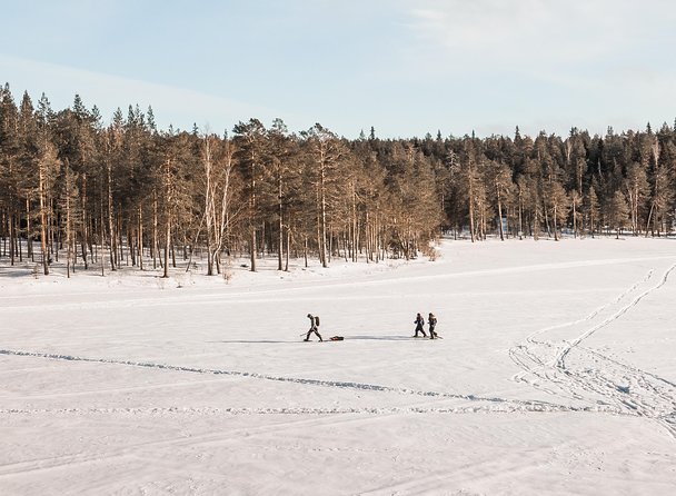 Snowshoeing and Ice Fishing Tour - The shore fire moment: Finnish snacks, sausages, and fire-making skills